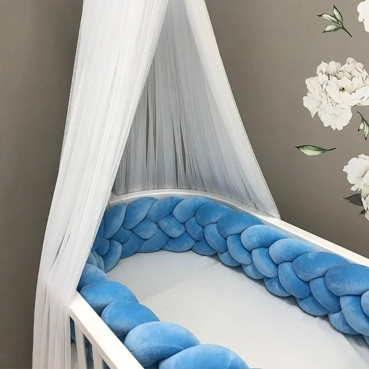 solid rich blue 4 strand braided crib bumper in white oval crib with white canopy, boy nursery decor