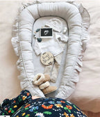 White ruffled organic cotton baby nest, gender neutral newborn lounger, hypoallergenic fill