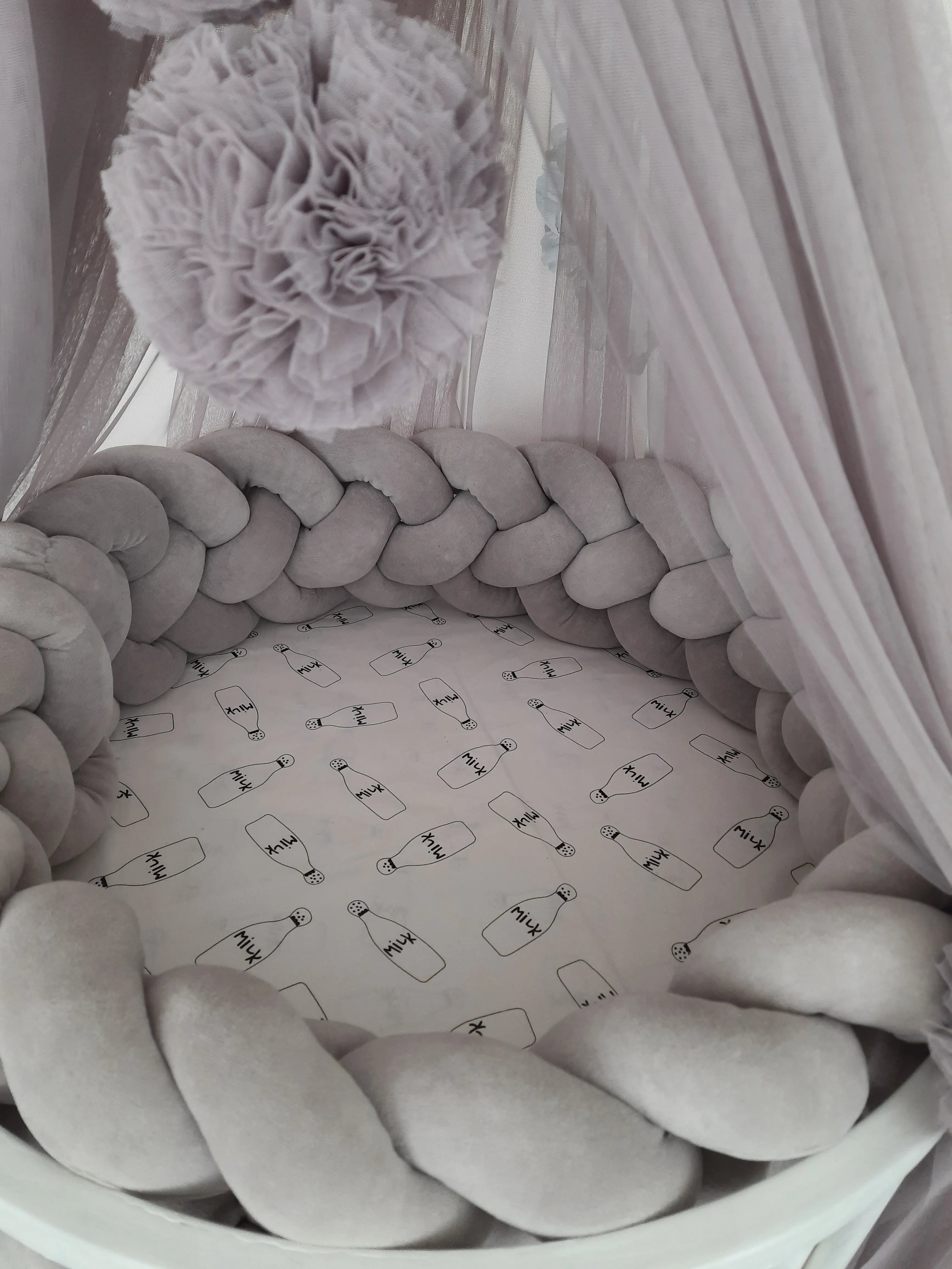 solid gray 4 strand braided crib bumper in round white crib with canopy, gender neutral nursery