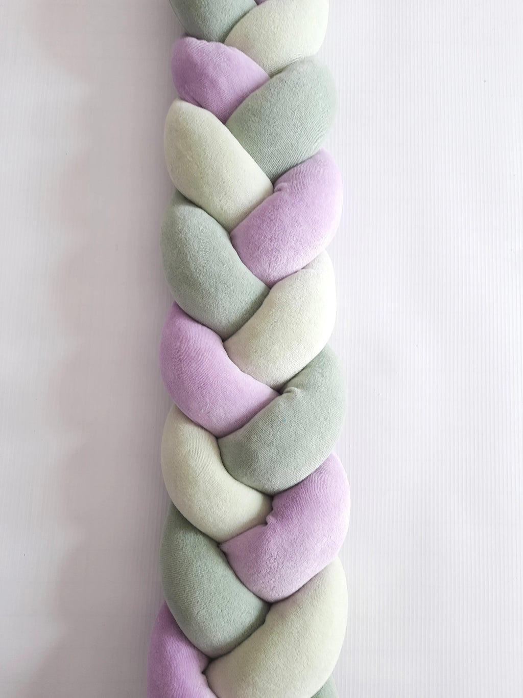 Dark olive light olive purple 3-strand braided crib bumper close-up, soft hypoallergenic cotton, gender neutral nursery