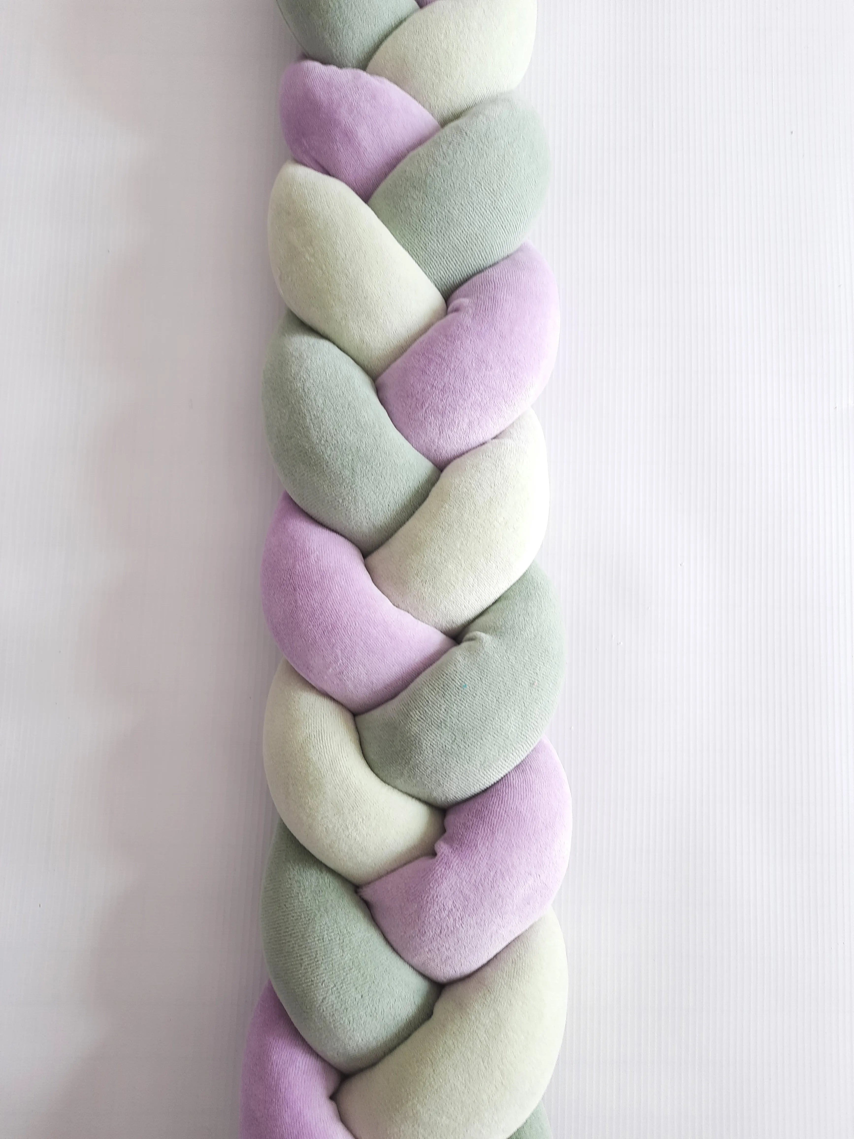 Dark olive light olive purple 3-strand braided crib bumper close-up, soft hypoallergenic cotton, gender neutral nursery