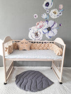 solid vanilla cream double braided crib bumper in natural wood standard crib, star pillow, floral nursery