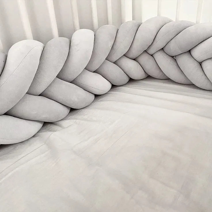 light gray mermaid braided crib bumper close-up cotton velour texture crib slats