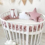 3 strand braided crib bumper rose blush in round crib, girl nursery with cloud pillow