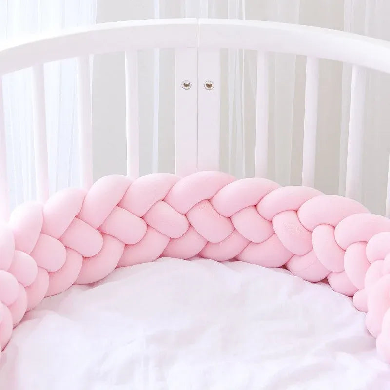 solid light pink 4 strand braided crib bumper in white round crib, girl nursery, OEKO-TEX cotton