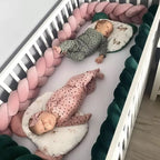 Rose gold and dark green 3-strand braided crib bumper with two babies sleeping, handmade cotton crib rail protection