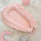 Pink ruffled baby nest for newborn girls, organic cotton baby lounger top view, CottonNest