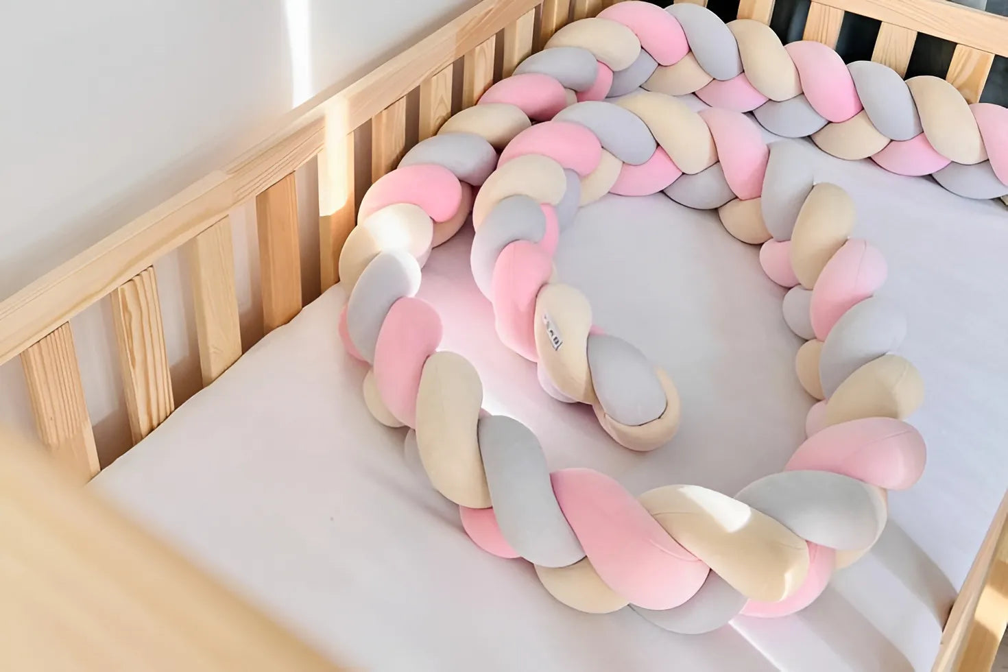 3-strand braided crib bumper pink gray cream beige in natural wood crib, gender neutral nursery