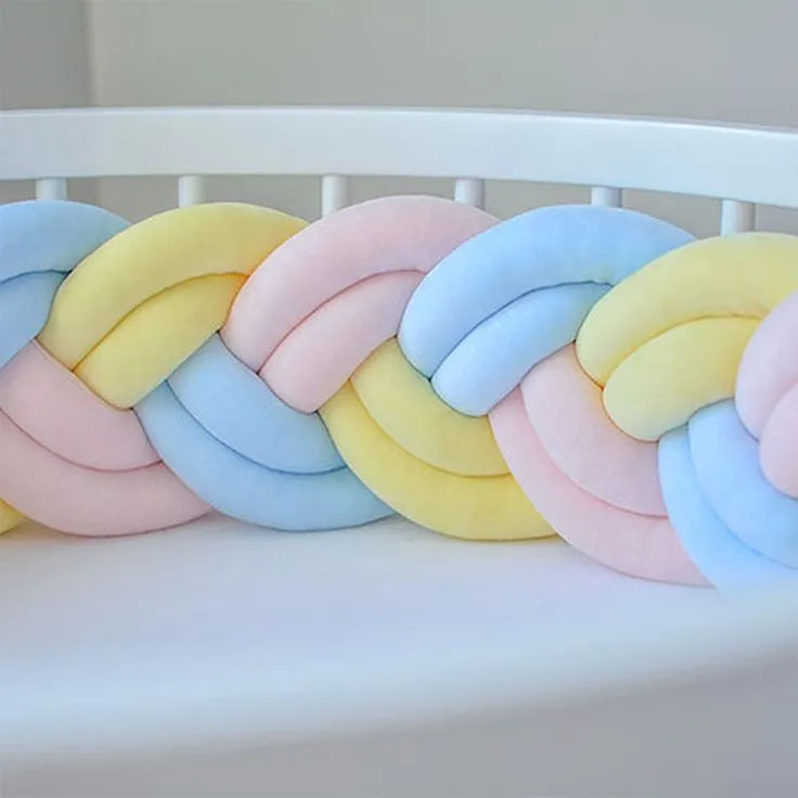 close up double braided crib bumper yellow blue pink pastel cotton velour texture, handmade baby bumper