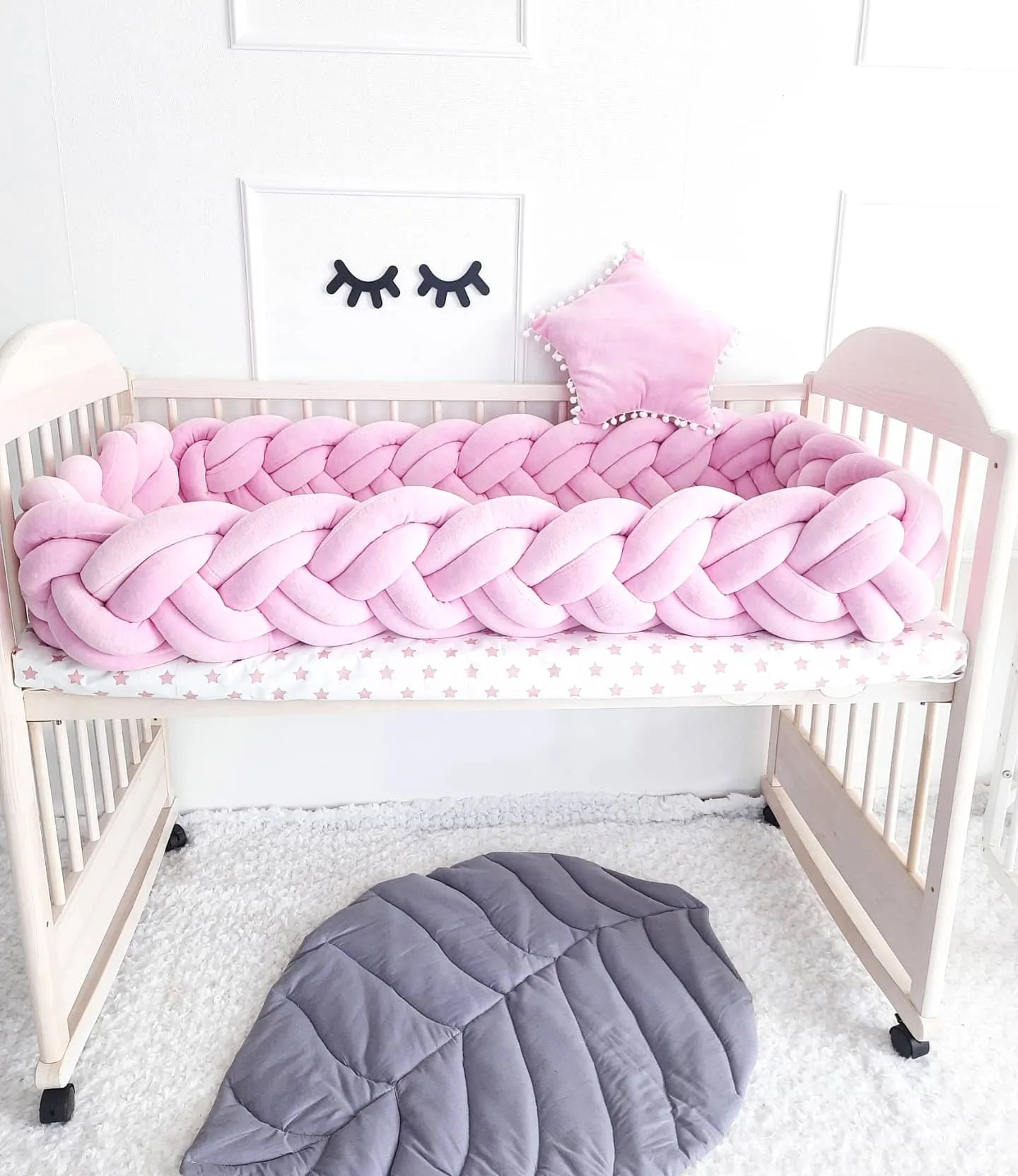 solid light pink double braided crib bumper in natural wood standard crib, girl nursery, hypoallergenic