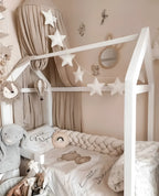 cream 4 strand braided crib bumper in white house bed with beige canopy, boho toddler nursery decor