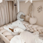 Premium cream braided crib bumper with 4 strands, made of soft cotton and hypoallergenic fill. A safe, stylish essential for any baby nursery.