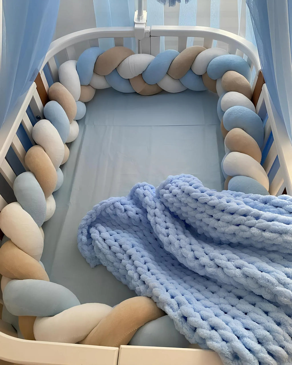 3 strand braided crib bumper blue cream white in oval crib with canopy, boy nursery