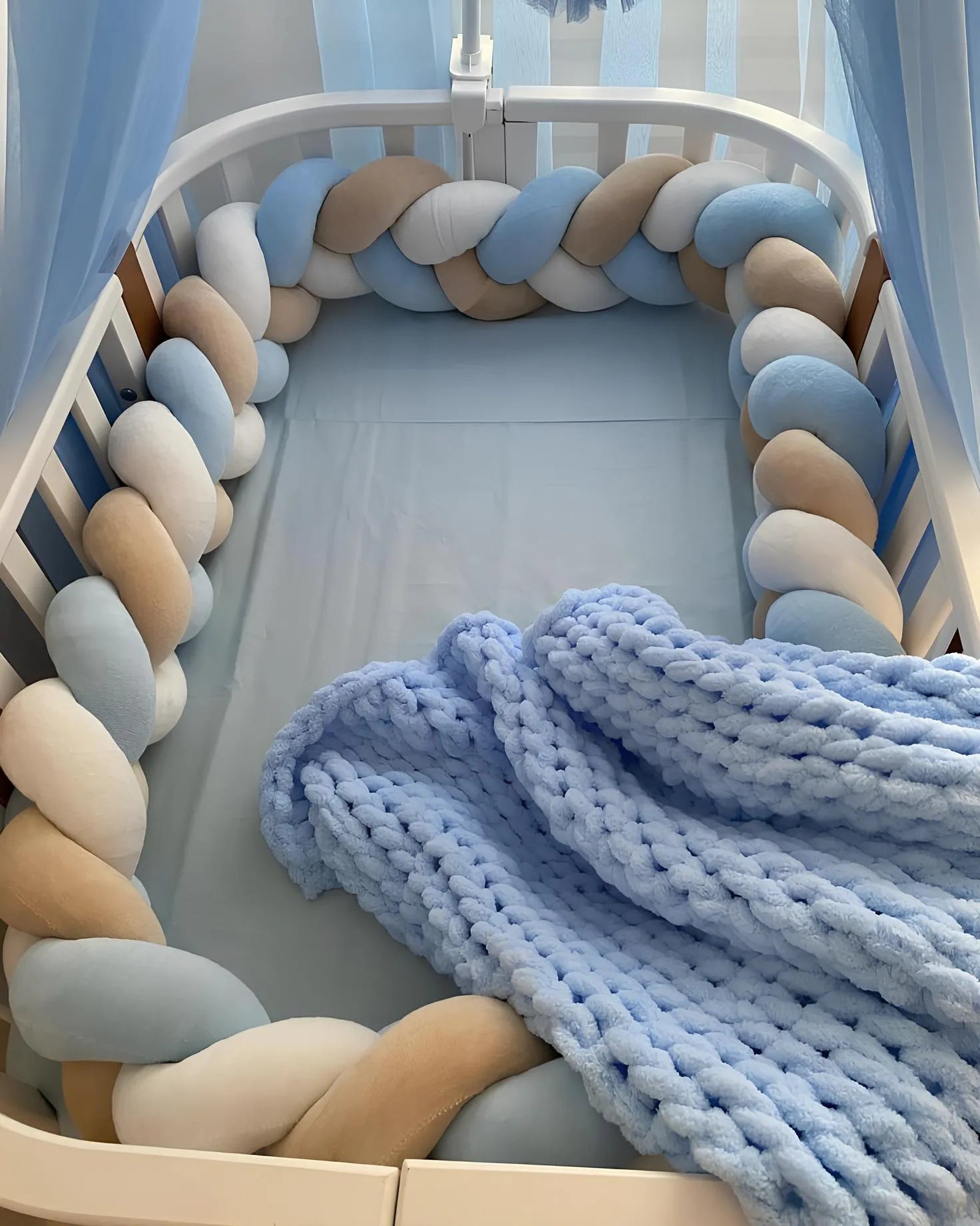 3 strand braided crib bumper blue cream white in oval crib with canopy, boy nursery
