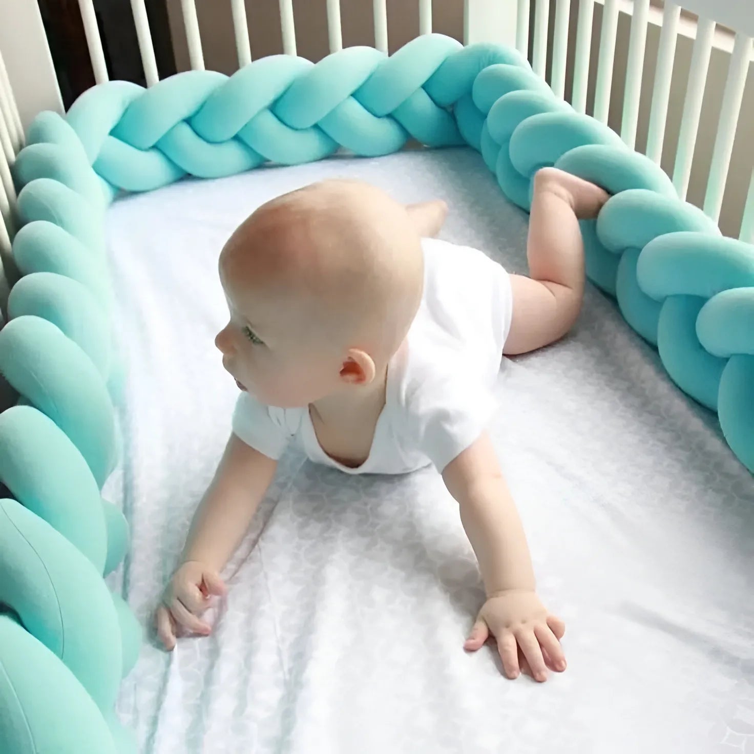 baby in crib with solid aqua 3 strand braided bumper, OEKO-TEX certified cotton, safe for newborns