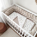warm beige mermaid braided crib bumper white crib floral bedding overhead view