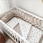 beige mermaid braid crib bumper white crib overhead view floral bedding