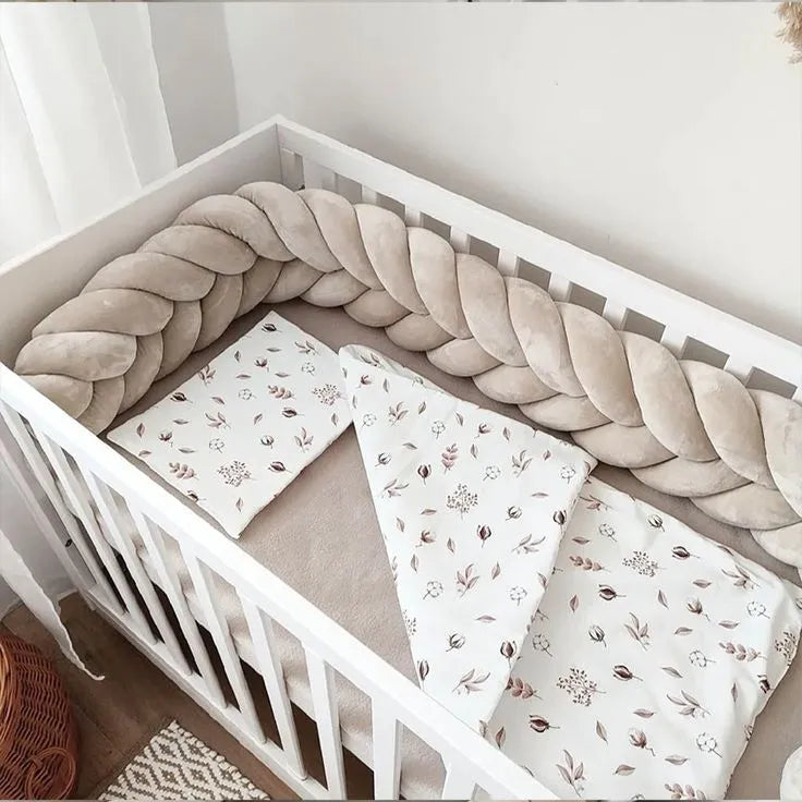 beige mermaid braid crib bumper white crib overhead view floral bedding