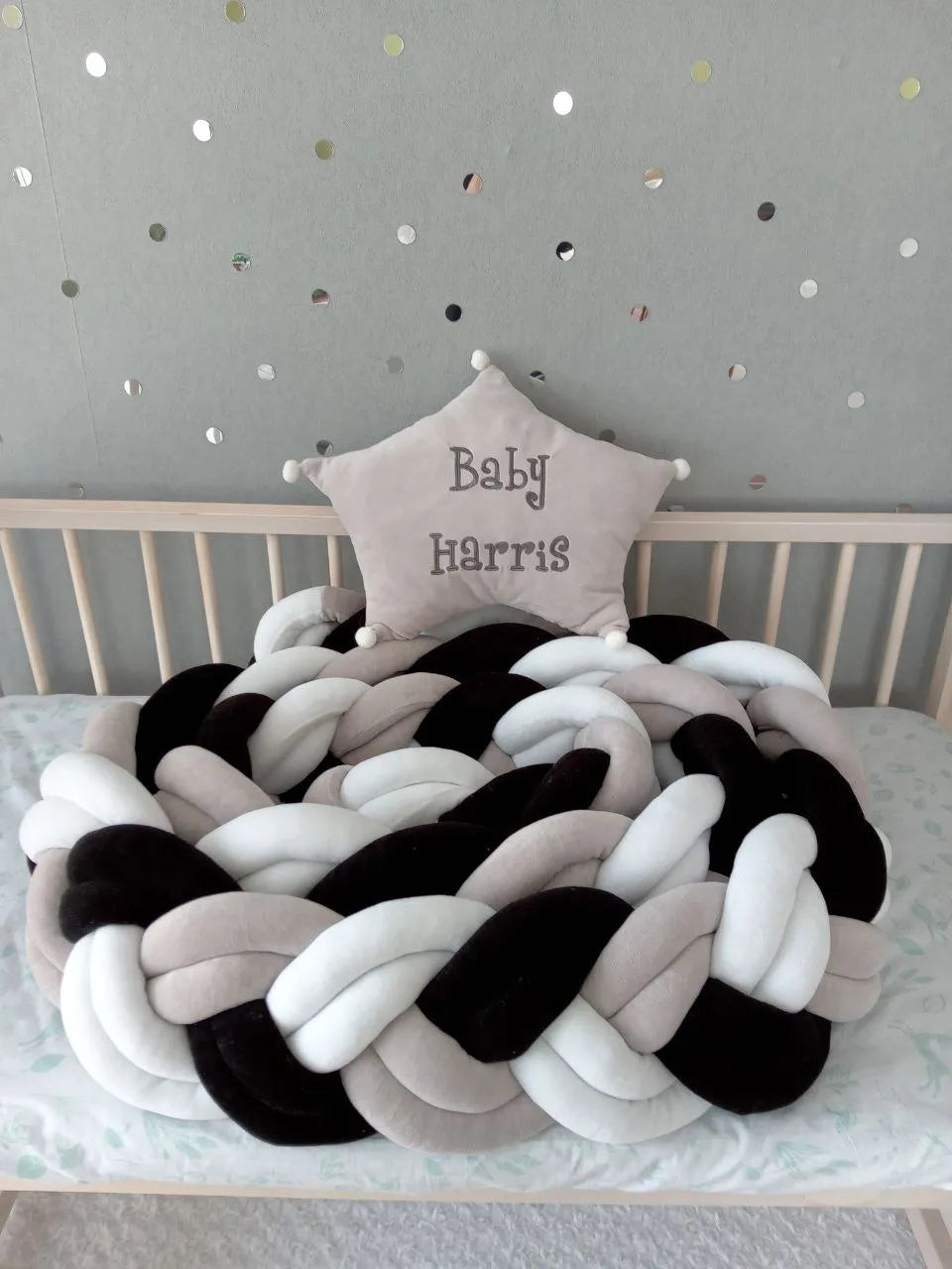 double braided crib bumper black white gray coiled in natural wood crib, modern gender neutral nursery