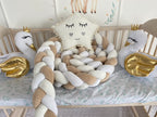 White milk cream beige 3-strand braided crib bumper in wooden crib with swan toys and star pillow, CottonNest